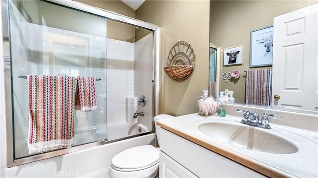 24939 Coral Canyon Rd, Corona, CA 92883 - full bathroom featuring vanity, toilet, and shower / bath combination with glass door