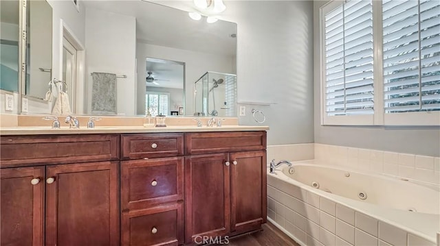24939 Coral Canyon Rd, Corona, CA 92883 - full bath featuring a shower stall, a tub with jets, a ceiling fan, wood finished floors, and double vanity