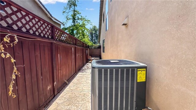 24939 Coral Canyon Rd, Corona, CA 92883 - exterior view of central air condition unit and stucco siding