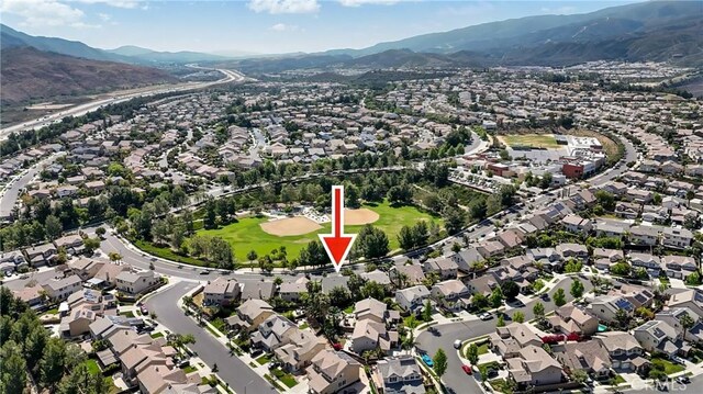 24939 Coral Canyon Rd, Corona, CA 92883 - view of property location featuring nearby suburban area, a mountain backdrop, and a golf club
