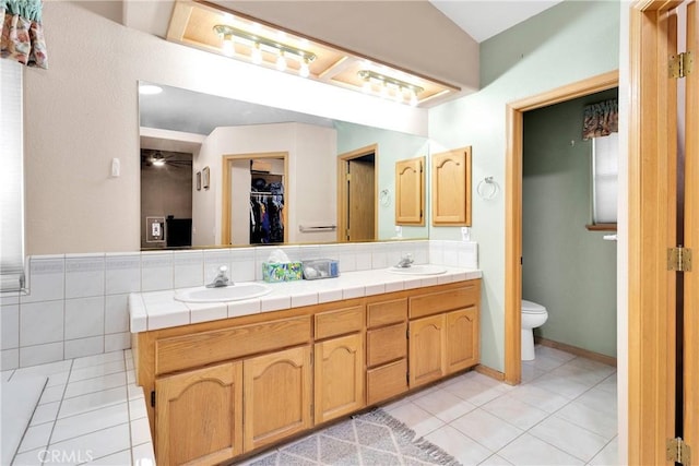 19804 Haida Rd, Apple Valley, CA 92307 - bathroom featuring a sink, tile patterned floors, and toilet
