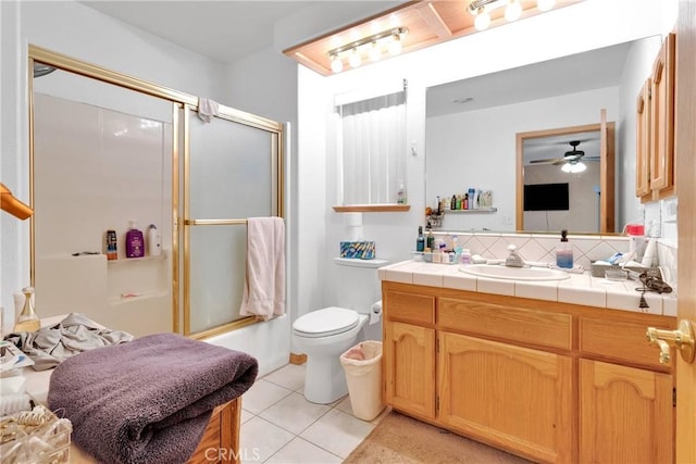 19804 Haida Rd, Apple Valley, CA 92307 - bathroom with tile patterned flooring, vanity, bath / shower combo with glass door, a ceiling fan, and backsplash