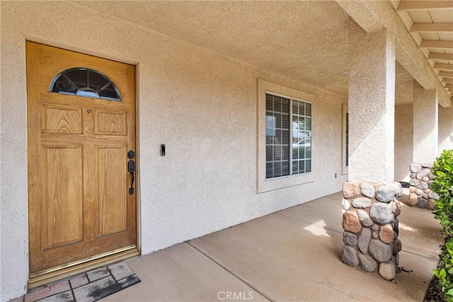 19804 Haida Rd, Apple Valley, CA 92307 - view of exterior entry featuring a porch and stucco siding
