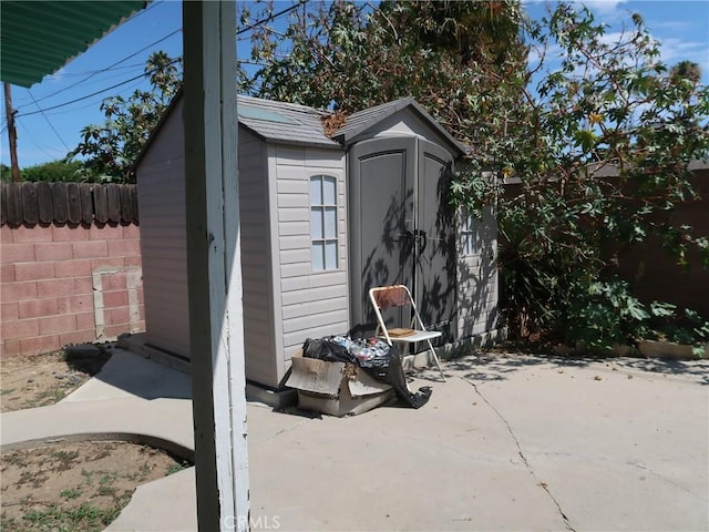 view of shed with a fenced backyard