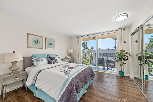 545 Chestnut Ave Unit 202, Long Beach, CA 90802 - bedroom featuring baseboards, access to outside, and wood finished floors