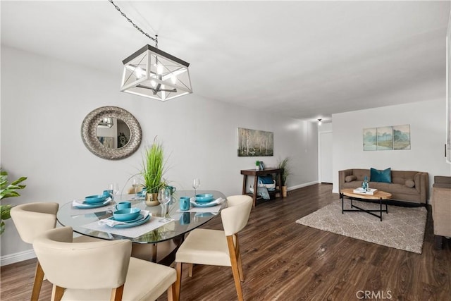 545 Chestnut Ave Unit 202, Long Beach, CA 90802 - dining space with baseboards, wood finished floors, and a notable chandelier