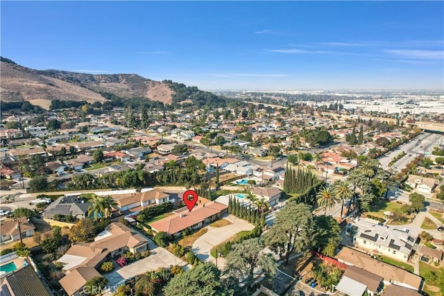 drone / aerial view featuring a residential view and a mountain view