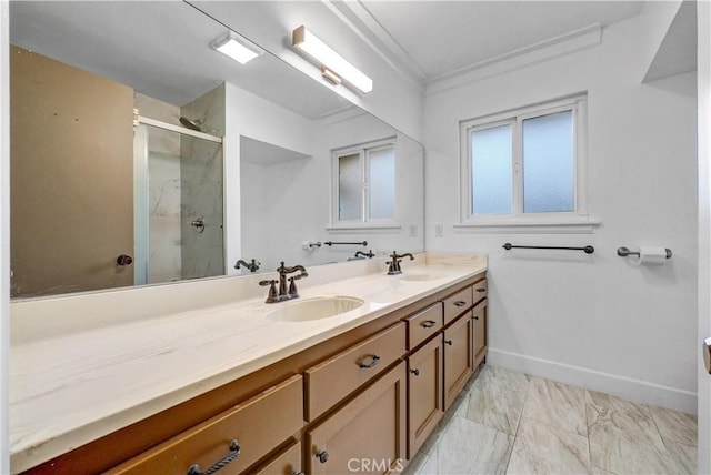 full bathroom with double vanity, a sink, marble finish floor, and a shower stall