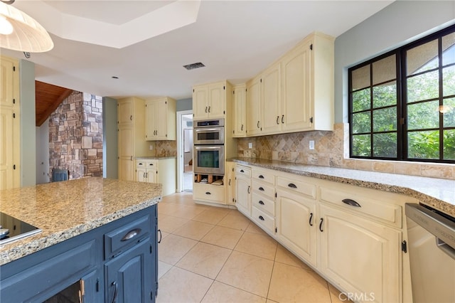 845 N Glendora Ave, Glendora, CA 91741 - kitchen featuring a wealth of natural light, decorative backsplash, stainless steel appliances, and blue cabinetry