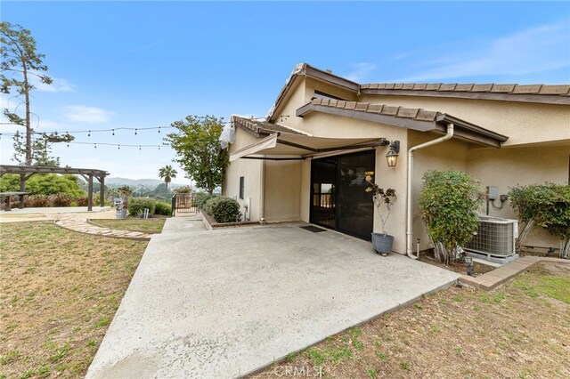 845 N Glendora Ave, Glendora, CA 91741 - view of home's exterior with central AC unit, a patio area, and stucco siding