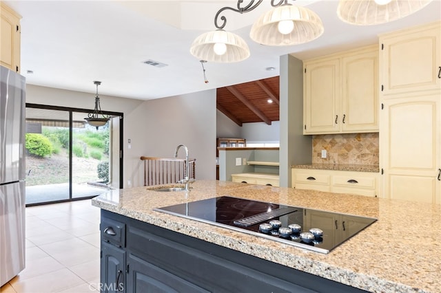 845 N Glendora Ave, Glendora, CA 91741 - kitchen with visible vents, freestanding refrigerator, black electric stovetop, cream cabinetry, and a sink
