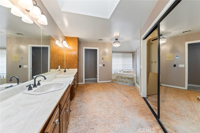 845 N Glendora Ave, Glendora, CA 91741 - bathroom featuring double vanity, visible vents, a sink, and a garden tub