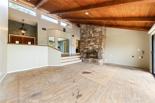 845 N Glendora Ave, Glendora, CA 91741 - unfurnished living room with high vaulted ceiling, a chandelier, a stone fireplace, beamed ceiling, and wood ceiling