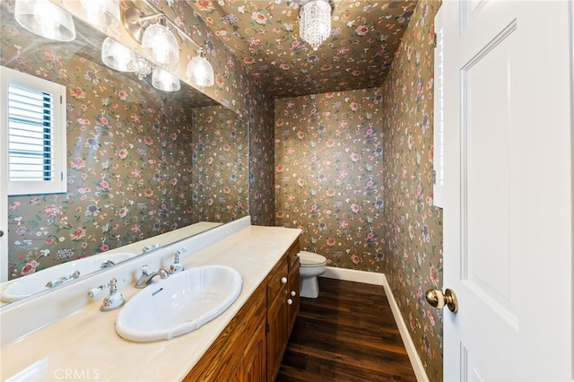 845 N Glendora Ave, Glendora, CA 91741 - bathroom with vanity, toilet, wallpapered walls, and wood finished floors