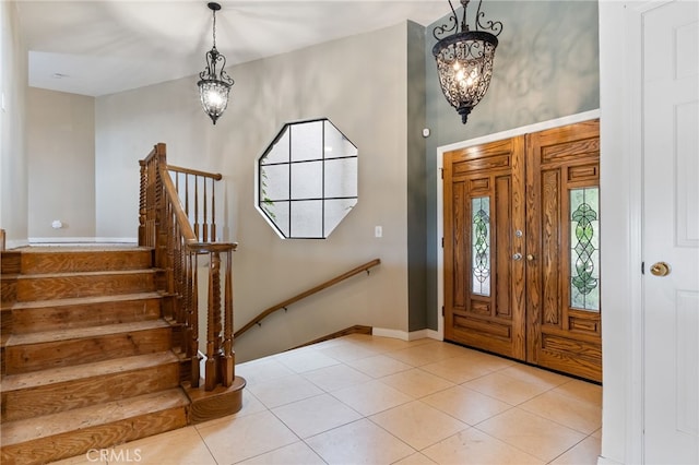 845 N Glendora Ave, Glendora, CA 91741 - entryway featuring light tile patterned floors, stairway, an inviting chandelier, and baseboards