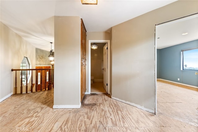845 N Glendora Ave, Glendora, CA 91741 - unfurnished room featuring baseboards, wood finished floors, and a chandelier
