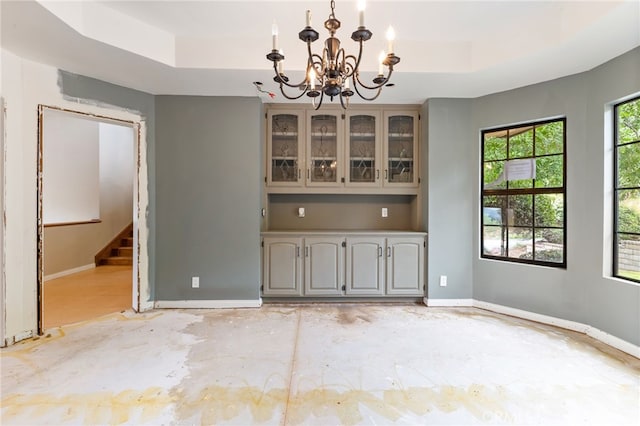 845 N Glendora Ave, Glendora, CA 91741 - unfurnished dining area featuring baseboards, a raised ceiling, and a chandelier