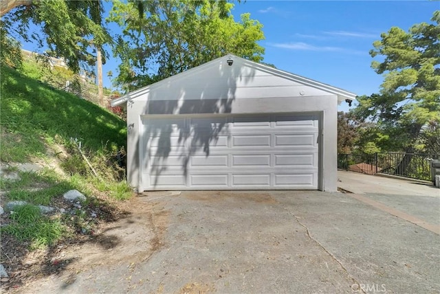 detached garage with fence