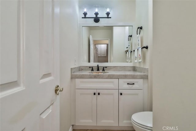 half bath with toilet and vanity