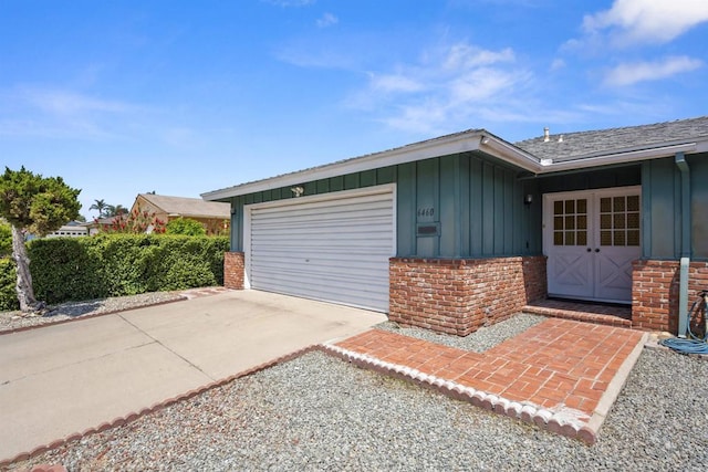 garage with concrete driveway
