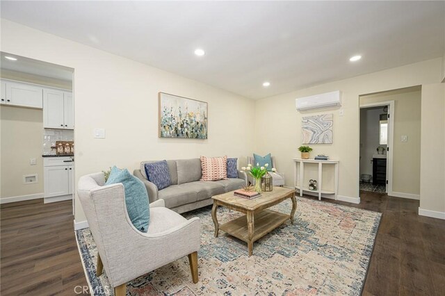 4548 Jade St, Los Angeles, CA 90032 - living room featuring an AC wall unit, recessed lighting, dark wood finished floors, and baseboards
