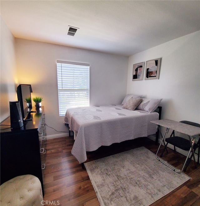 7353 W Ellena W Unit 83, Rancho Cucamonga, CA 91730 - bedroom with dark wood finished floors and baseboards