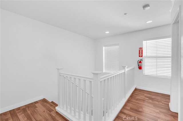 7353 W Ellena W Unit 83, Rancho Cucamonga, CA 91730 - hallway featuring an upstairs landing, wood finished floors, baseboards, and recessed lighting