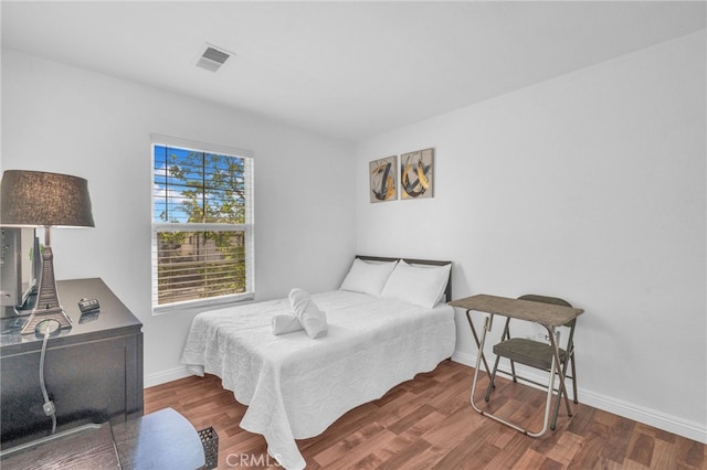 7353 W Ellena W Unit 83, Rancho Cucamonga, CA 91730 - bedroom featuring baseboards and wood finished floors