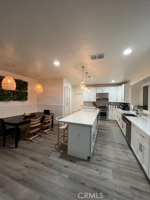 27041 S Ridge Dr, Mission Viejo, CA 92692 - kitchen with stainless steel electric range, recessed lighting, dishwasher, dark wood-type flooring, and a center island