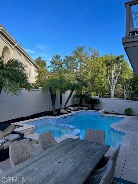 27041 S Ridge Dr, Mission Viejo, CA 92692 - view of swimming pool with a fenced backyard and a pool with connected hot tub
