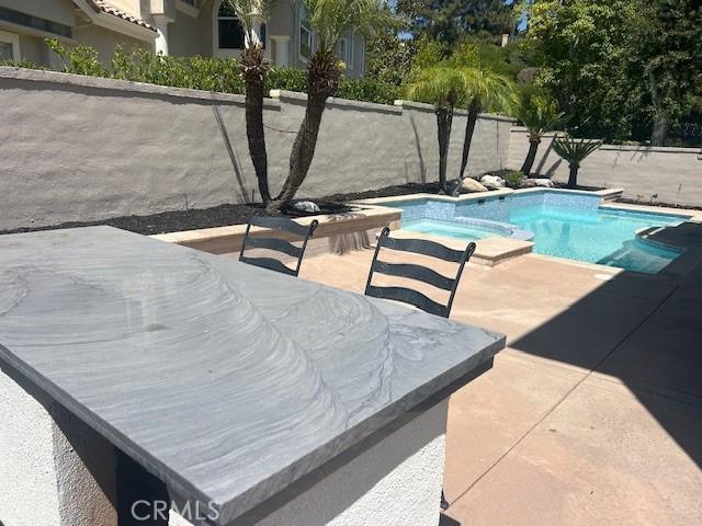 27041 S Ridge Dr, Mission Viejo, CA 92692 - view of pool with a patio area and a pool with connected hot tub