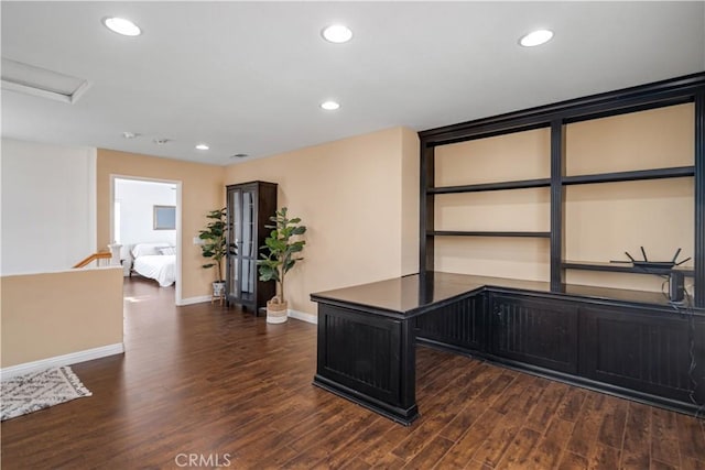 unfurnished office featuring baseboards, recessed lighting, wood finished floors, and attic access