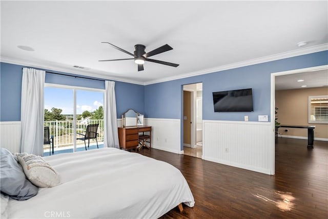 bedroom with wainscoting, multiple windows, access to exterior, wood finished floors, and visible vents
