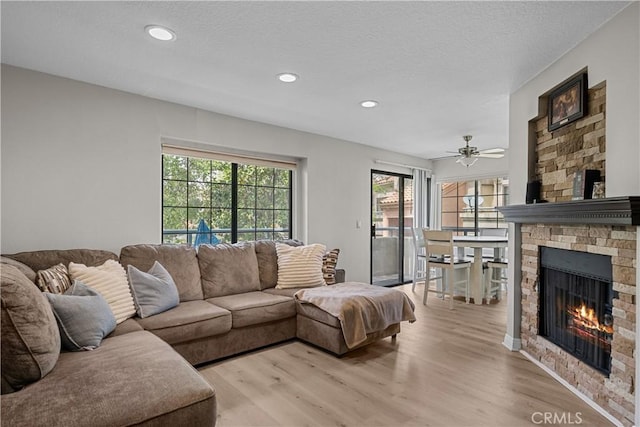 18114 Erik Ct Unit 5131, Canyon Country, CA 91387 - living room featuring plenty of natural light, light wood-style floors, a fireplace, recessed lighting, and ceiling fan
