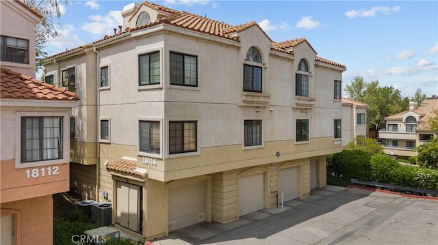 18114 Erik Ct Unit 5131, Canyon Country, CA 91387 - view of property featuring a garage and driveway