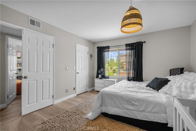 18114 Erik Ct Unit 5131, Canyon Country, CA 91387 - bedroom with light wood-style flooring and baseboards