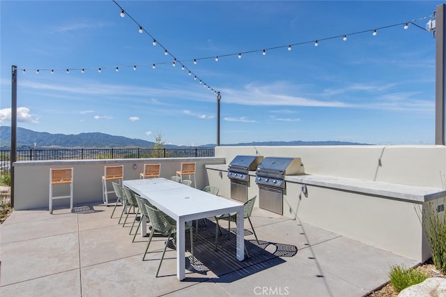 18147 Jupiter Ln, Saugus, CA 91350 - view of patio / terrace featuring a mountain view and outdoor dining space