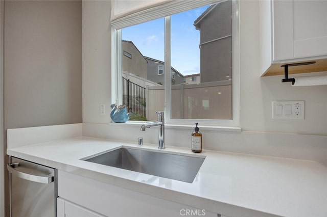 18147 Jupiter Ln, Saugus, CA 91350 - kitchen with a sink, white cabinets, dishwasher, and light countertops