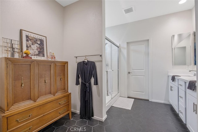 18147 Jupiter Ln, Saugus, CA 91350 - full bathroom featuring a stall shower, vanity, and baseboards