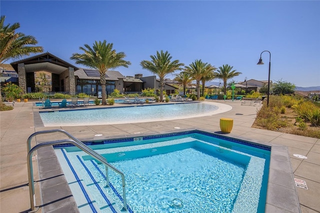 18147 Jupiter Ln, Saugus, CA 91350 - community pool featuring a patio area