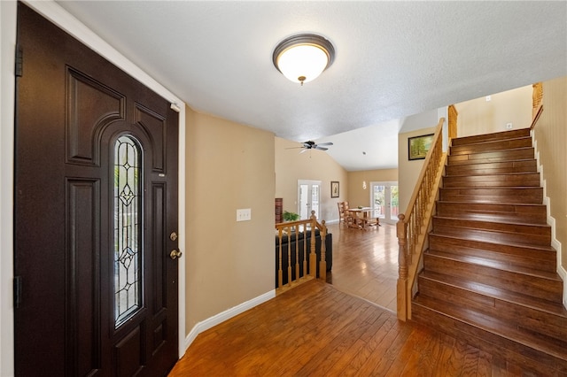 45628 Gleneagles Ct, Temecula, CA 92592 - entryway with a ceiling fan, stairway, baseboards, wood-type flooring, and lofted ceiling
