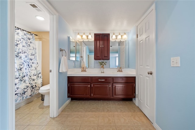45628 Gleneagles Ct, Temecula, CA 92592 - full bathroom with double vanity, toilet, a sink, and tile patterned flooring