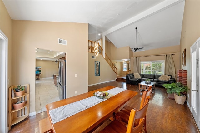 45628 Gleneagles Ct, Temecula, CA 92592 - dining space with ceiling fan, visible vents, high vaulted ceiling, baseboards, and stairs