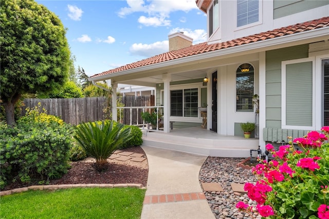 45628 Gleneagles Ct, Temecula, CA 92592 - doorway to property with fence, a chimney, a porch, and a tile roof