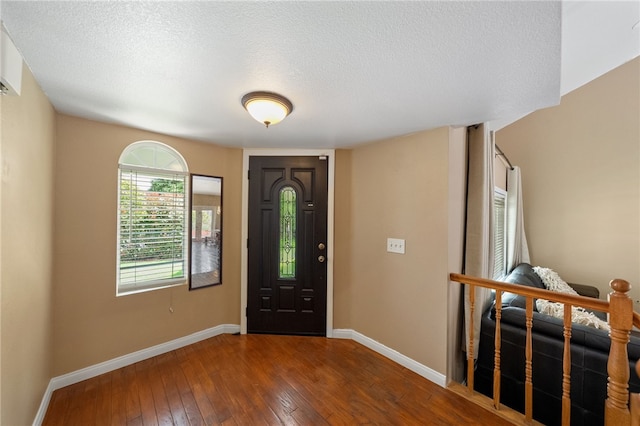45628 Gleneagles Ct, Temecula, CA 92592 - entrance foyer with a textured ceiling, baseboards, and hardwood / wood-style floors