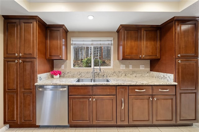 45628 Gleneagles Ct, Temecula, CA 92592 - kitchen featuring light stone counters, a sink, dishwasher, and tasteful backsplash