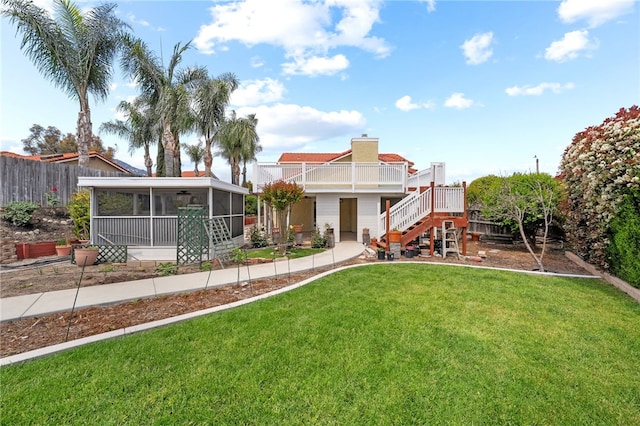 45628 Gleneagles Ct, Temecula, CA 92592 - back of house with fence, a chimney, a sunroom, stairs, and a lawn