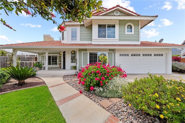 45628 Gleneagles Ct, Temecula, CA 92592 - mediterranean / spanish-style house featuring fence, a garage, a porch, concrete driveway, and a tiled roof