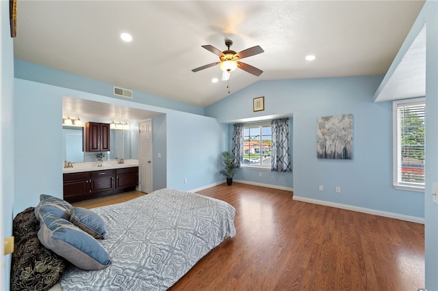 45628 Gleneagles Ct, Temecula, CA 92592 - bedroom with visible vents, wood finished floors, baseboards, ensuite bath, and vaulted ceiling