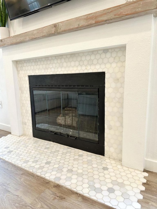 10525 Flora Verda Ct, Santee, CA 92071 - interior details with baseboards, a tile fireplace, and wood finished floors